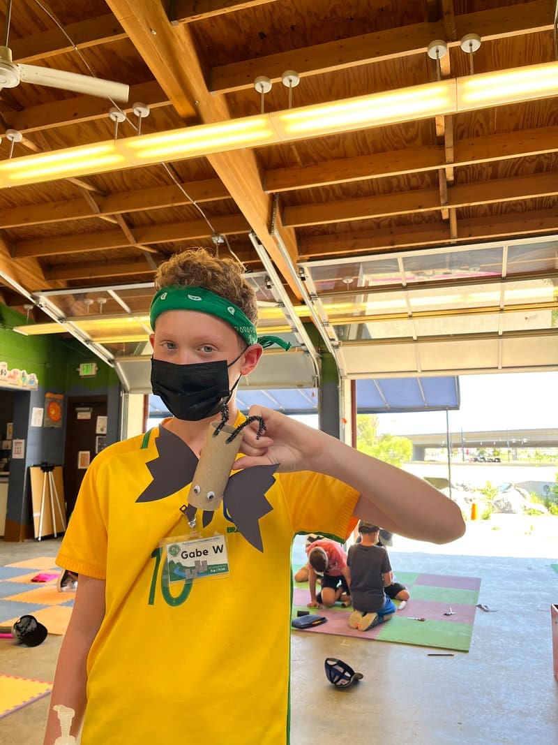 SPREE Camper holding at bat craft.