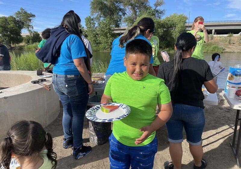 Participant eating at the My Outdoor Colorado Family Campout